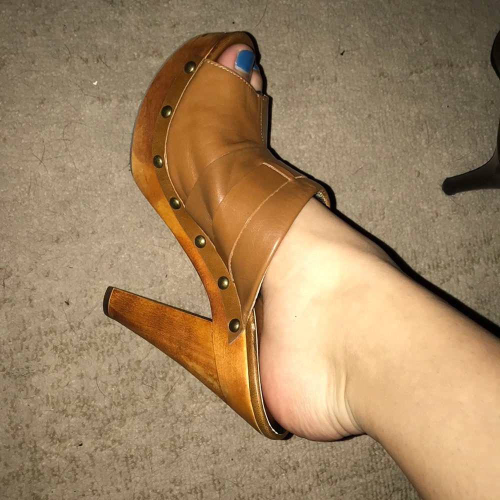 Brown leather heels.